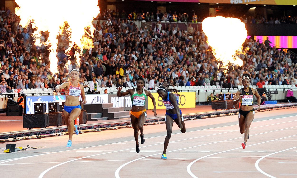 Tori Bowie dips for world 100m glory